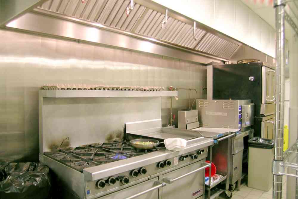 What Are the Pros and Cons of Cleaning My Kitchen Exhaust Myself